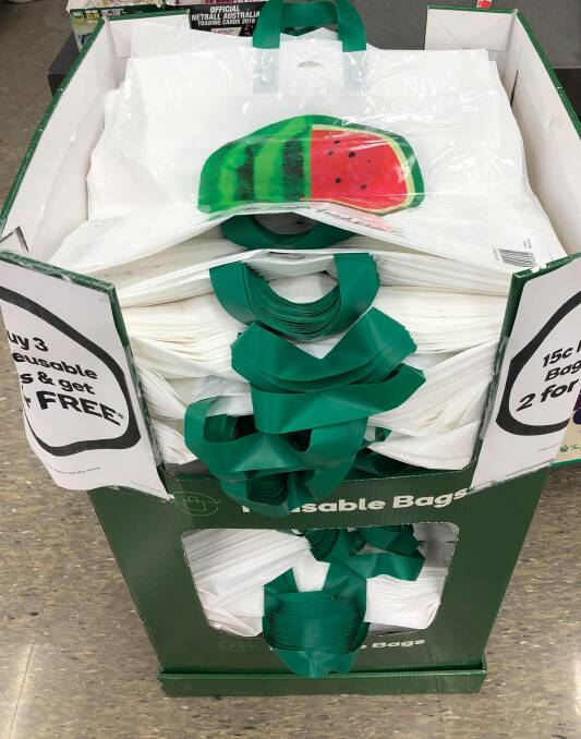 VALUE: Woolworths is running a 'buy three get two free' scheme, allowing shoppers to pay 45 cents for three reusable plastic bags and receive an extra two for free.