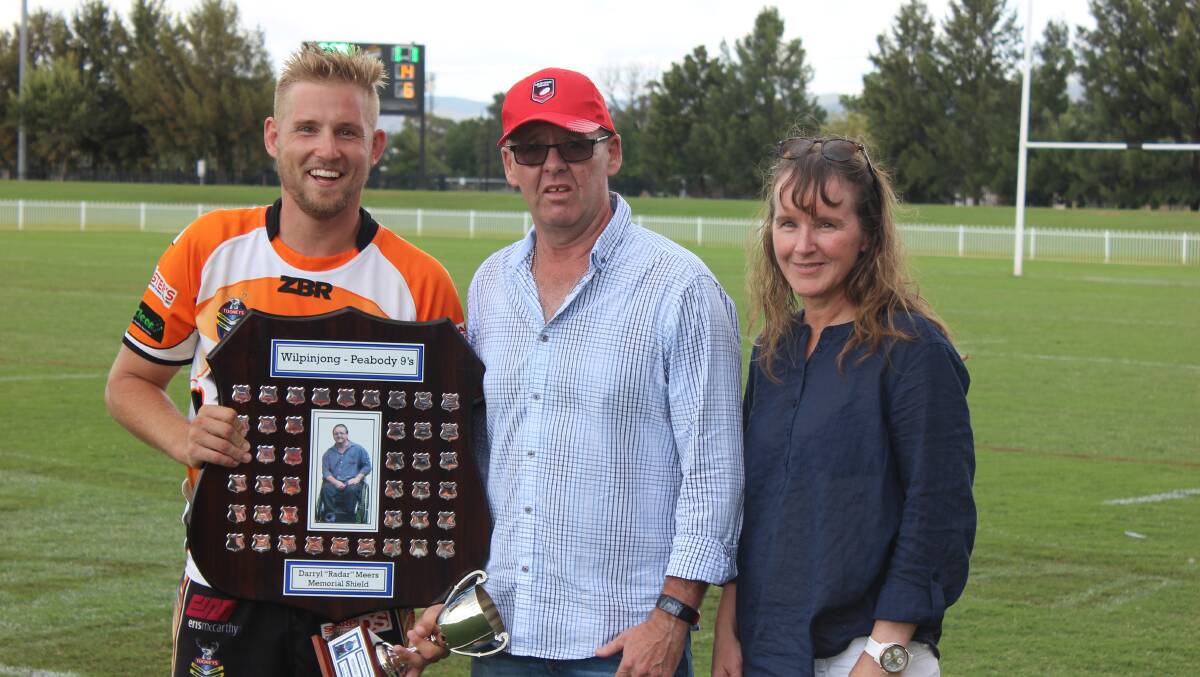CHAMPIONS: Matt Kilick captained The Entrance Tigers to a Mudgee nines championship and was presented the shield by Glenn Meers and Deanna Achurch. Photo Jake Humphreys