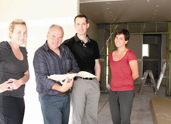 DOCTOR IN THE HOUSE: University of Wollongong Graduate School of Medicine Facilities Development Manager Keith Smith (second from left) shows  University of Wollongong School of Medicine students Claire Spry, Lloyd Malone and Elizabeth Whitmore around the soon to be completed house for medical students in Mudgee.	120312/rmuow/008 