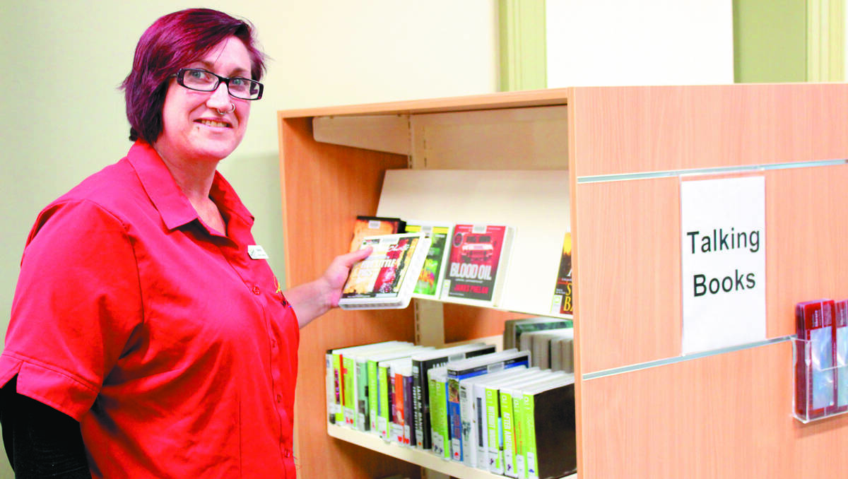 Edwina Matheson of Mid-Western Regional Library invites vision impaired users to try the talking book collection.