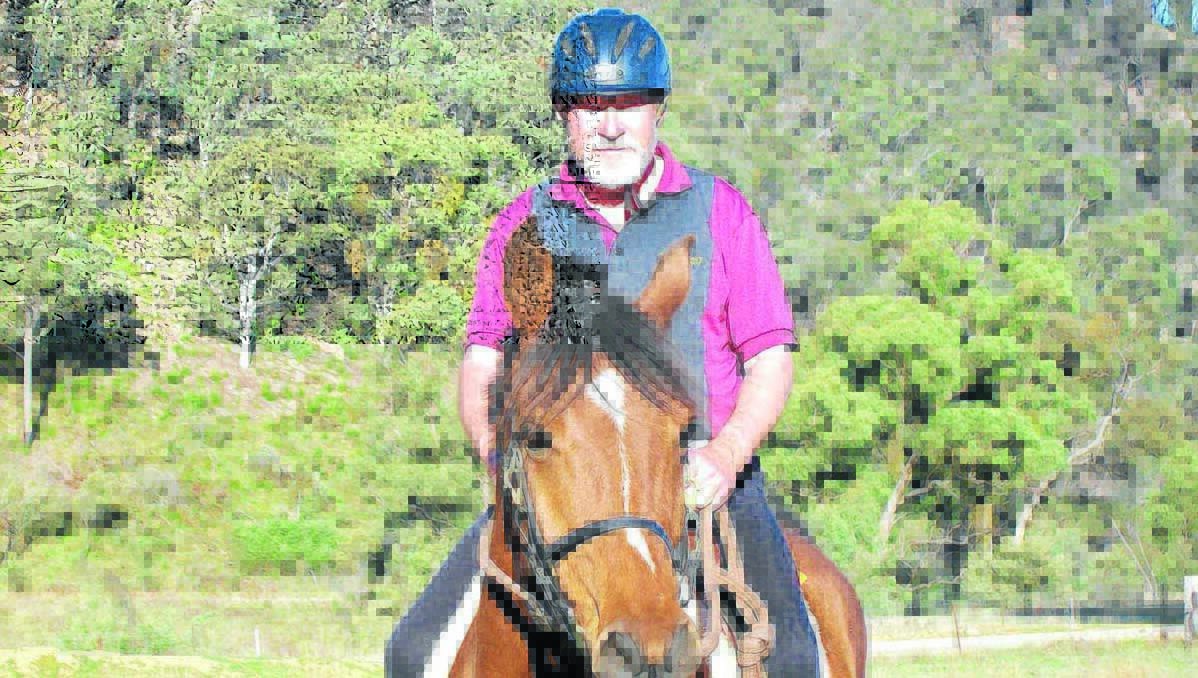 CHAMPION PAIR: Local rider John Howe with his horse Ashbend Perazzi, or Ears as the 12-year-old is known. Howe joined an exclusive club when he completed 10,000km of endurance riding. 