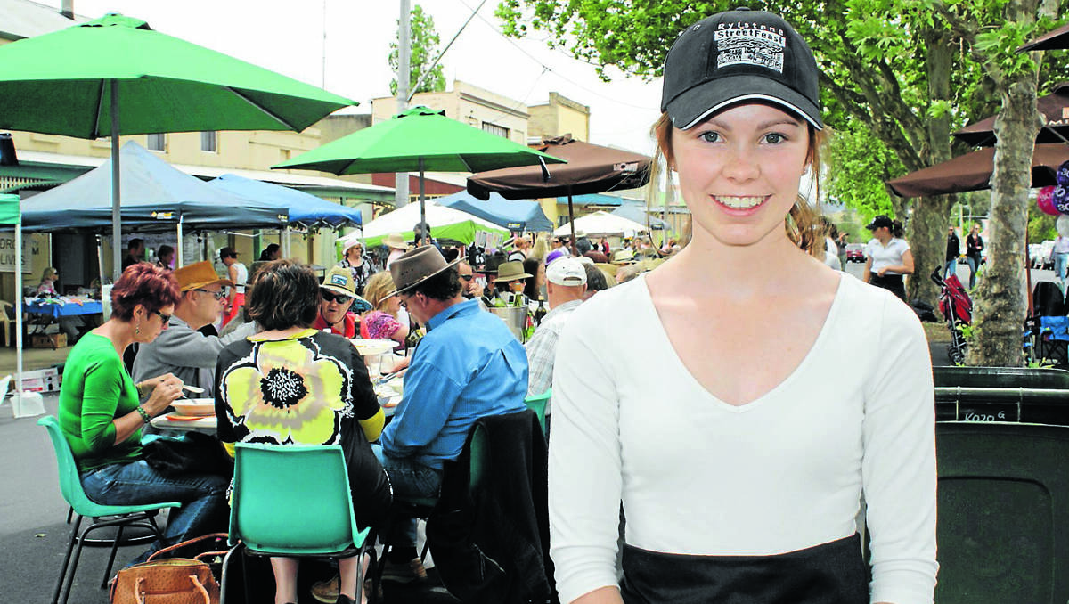First-time volunteer Natalie Bowles returned from Bathurst to help out at the Long Lunch. 	 031112/rmstreetfeast/004