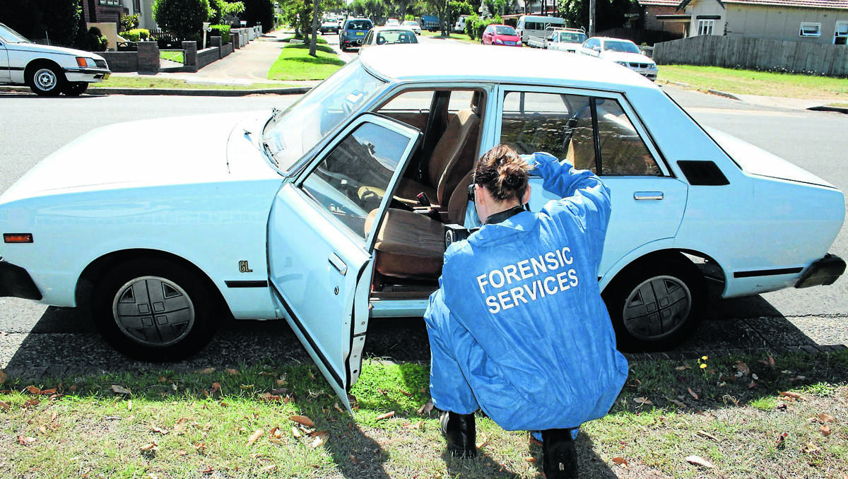 Police examine a Datsun Stanza similar to a vehicle seen in Coolah on the night Penny Hill was assaulted.	260313/pennyhillinvestigation