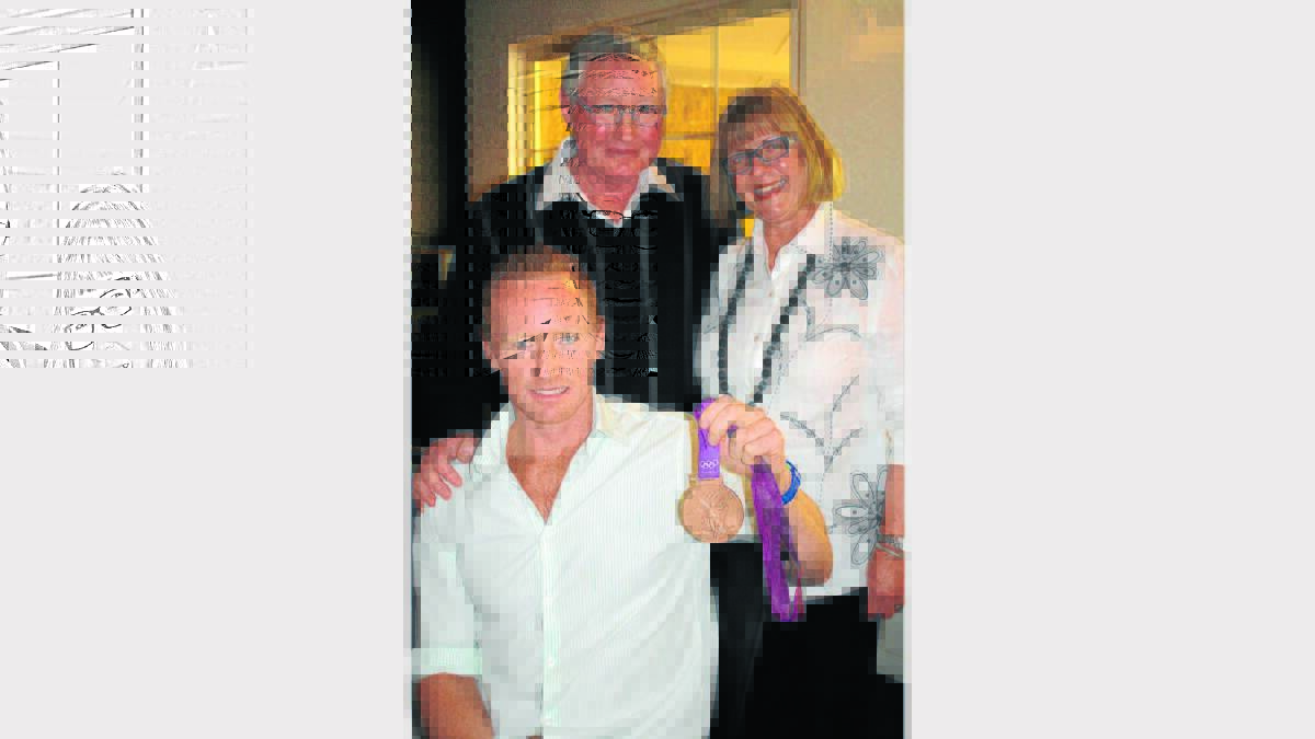 Dan Noonan with his father Peter and stepmother Sandra at a lunch in his honour at Parklands Resort in Mudgee on Saturday. 	030912/rmmedallist/002