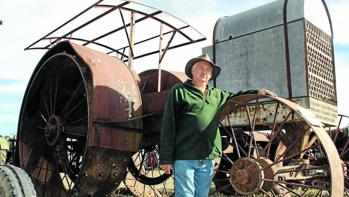 A BIG DEAL: Cudgegong Valley Antique Machinery Club President Brian Jones pictured with an Emerson Brantingham Big 4 tractor, one of many exhibits at the 14th National Historical Machinery Association Rally at AREC last weekend.	190413/spAntiqueMachineryrally/023