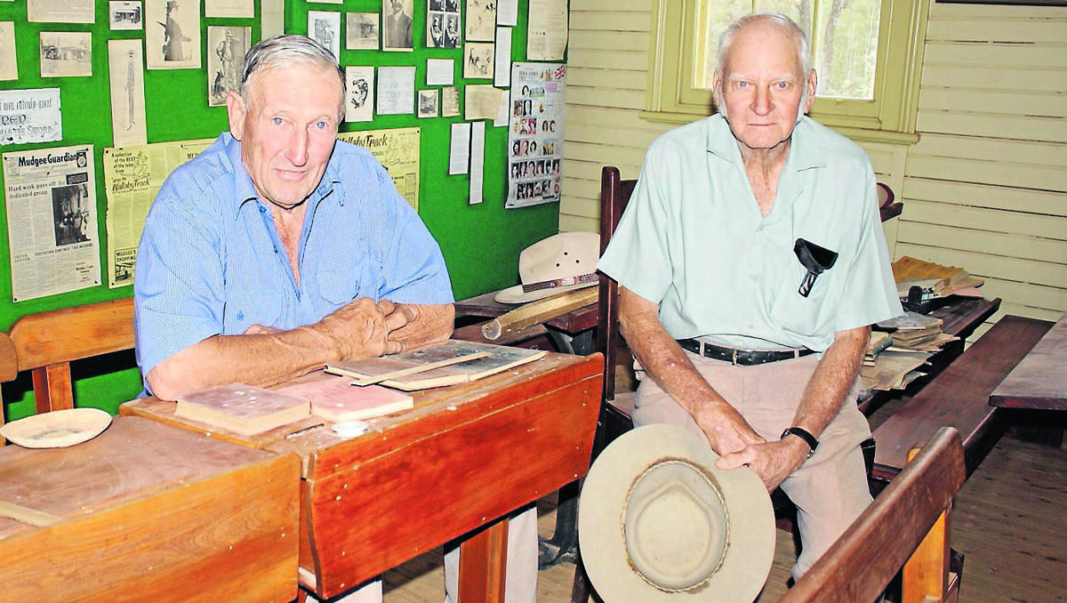 Malcolm Roth and Lyndsay Pyne reminisce over their school days in the classroom on the Eurunderee School on Saturday.