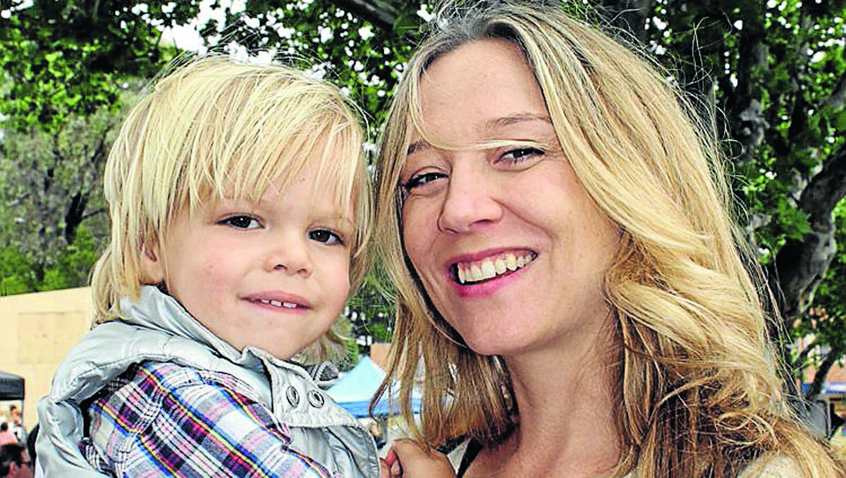 Siobhan Rothwell, pictured with her son Oliver, said Street Feast was a great event for the community.	031112/rmstreetfeast/13